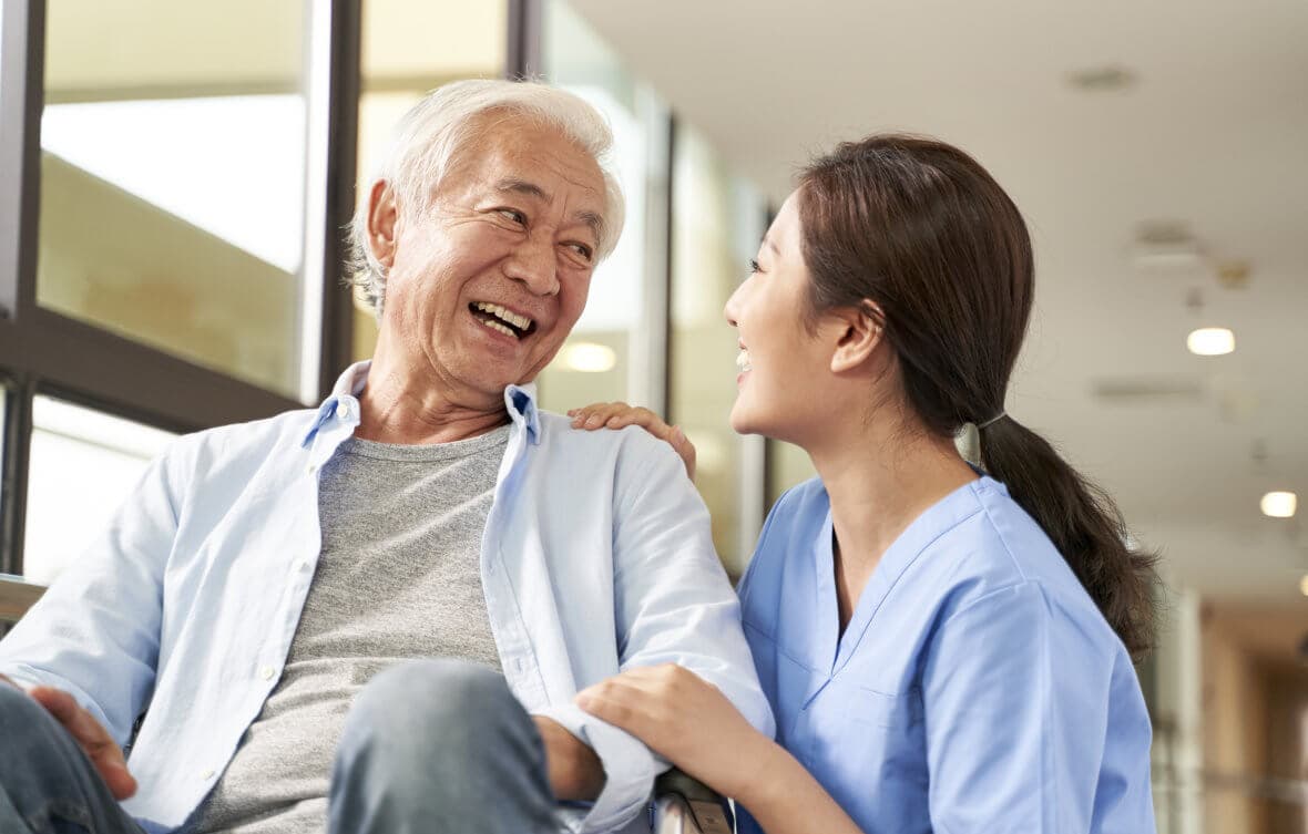 image of a caregiver and an elderly patient